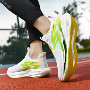 White marathon racing shoes with green lightning logo on a professional track