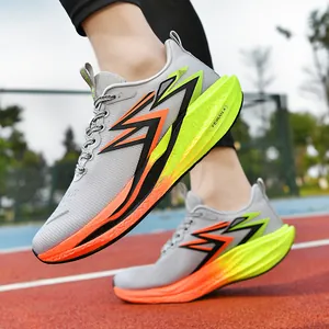 Racing running shoes for men and women on red track featuring breathable grey mesh and FEIRAN 4 logo