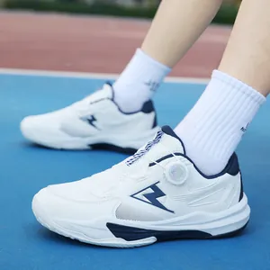 White and blue lightweight athletic tennis shoes with dial lacing system on a sports court