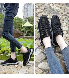 Detail of black breathable mesh hiking shoes with anti-slip rubber soles for outdoors