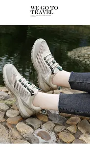 Detail of breathable mesh hiking shoes with anti-slip thick rubber soles in a natural outdoor setting