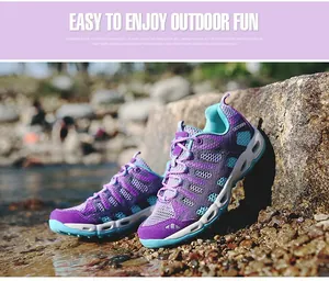 Detail of purple mesh outdoor wading shoes with blue drainage holes and non-slip sole