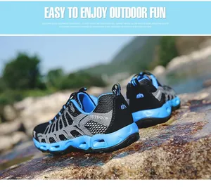 Detail of blue hollow outsole and gray mesh fabric on lightweight outdoor hiking shoes
