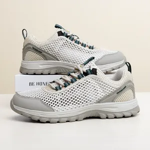 Lightweight breathable trekking shoes in beige and grey for outdoor hiking and travel