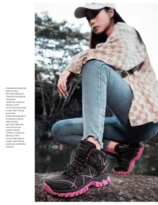 Outdoor hiking shoes detail with black leather and pink non-slip sole in nature scenery
