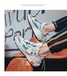Detaillierte Seitenansicht der Leder-Sneaker mit blauen und orangen Akzenten