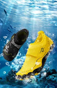 Detailed view of breathable honeycomb mesh water shoes with non-slip rubber soles in water