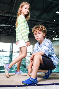 Detail of non-slip rubber soles and breathable fabric on children's beach swim shoes