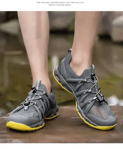 Close-up of quick-lace system and honeycomb mesh on gray and yellow wading shoes