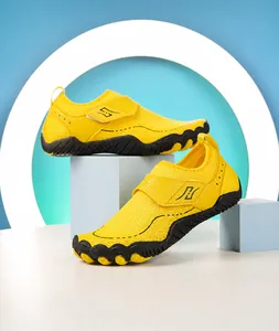 Detail of bright yellow water shoe with breathable mesh and anti-slip rubber sole