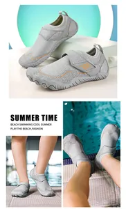 Close-up of gray mesh water shoes featuring orange accents and protective split-toe design