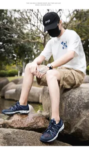 Detail of blue breathable mesh outdoor wading shoes with quick-lace system and drainage sole