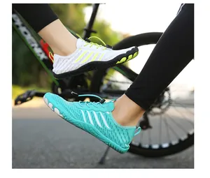 Action shot of breathable outdoor water shoes with quick-lace system during cycling