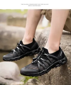 Detail of breathable black mesh upper and outdoor strap on amphibious hiking shoes