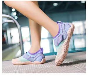 Detail of non-slip rubber sole and gradient mesh on lightweight wading shoes