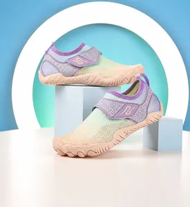 Detail view of water shoes featuring breathable mesh upper and adjustable velcro strap