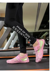 Detail of pink kids' water shoe with quick-dry fabric and velcro strap on treadmill