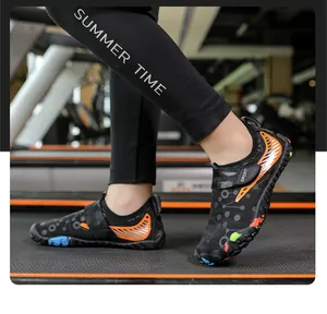 Macro detail of breathable black kids water shoes with orange stripes on a treadmill