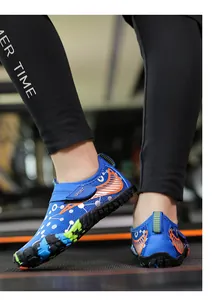Detail view of quick-dry blue kids' water shoes with non-slip rubber soles and sport straps