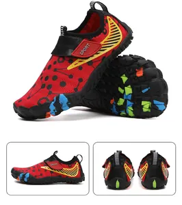Detail of non-slip rubber sole and breathable fabric on red kids water shoes