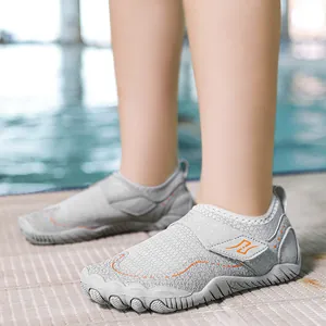 Breathable mesh water shoes with non-slip rubber soles and orange velcro straps