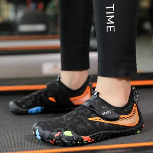 Kids quick-dry water shoes in black with orange stripes and breathable mesh upper