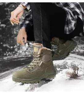 Detail of army green outdoor tactical boot with warm brown fleece lining in the snow