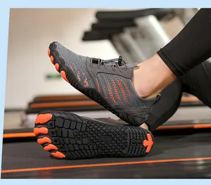 Close-up of five-toe outdoor wading shoes with grey fabric and orange non-slip rubber soles