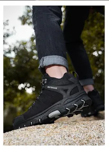 Detail view of durable black hiking boots with slip-resistant rubber soles and rugged texture