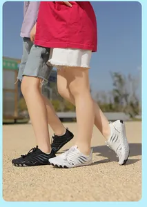 Detail of breathable mesh kids water shoes with quick-lace system and grippy rubber outsoles