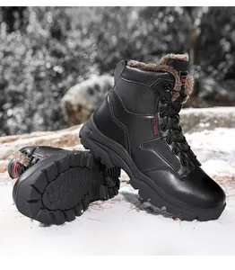 Close-up of black winter outdoor boots with warm plush lining and non-slip rubber soles