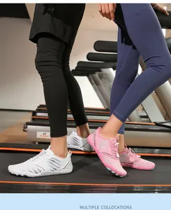 Detail of quick-lace system and breathable mesh on white and pink water shoes