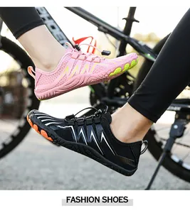 Detail of pink and black outdoor water shoes with quick-lace system and anti-slip sole