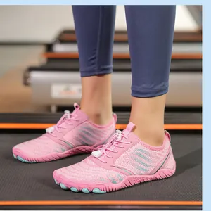 Pink breathable mesh water shoes for women on treadmill with quick-lace system