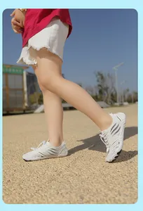 Close-up of kids white breathable mesh water shoes with elastic drawstrings and rubber soles
