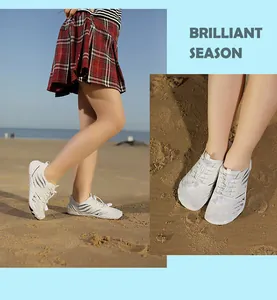 Detail of white barefoot water shoes with breathable mesh and anti-slip rubber soles