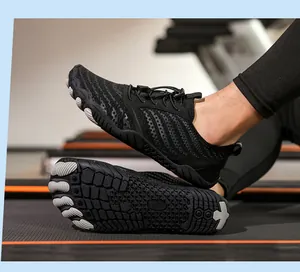 Detail of quick-dry water shoes with anti-slip rubber soles on a gym treadmill