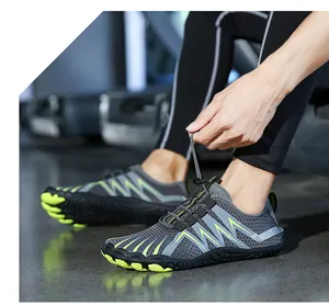 Detail of grey outdoor trail shoe with breathable mesh and anti-slip rubber sole