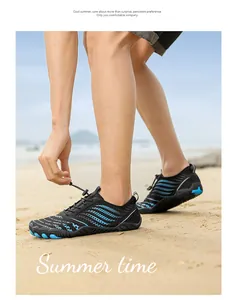 Close-up of quick-dry water shoes with breathable mesh and anti-slip sole on sandy beach