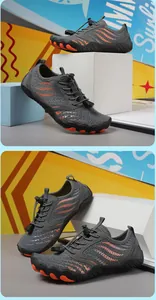 Detail of grey water shoes with breathable mesh and orange streamline patterns