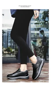 Detail view of black slip-on walking shoes with warm plush lining and non-slip sole
