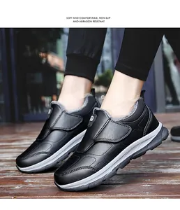 Detail of warm grey plush lining and velcro strap on black leather hiking shoes