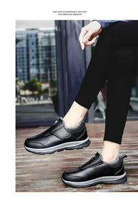 Close-up of black non-slip casual shoes with warm grey fur lining and thick rubber sole