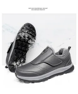 Close-up of gray thermal outdoor shoes with thick plush lining on snowy mountain background