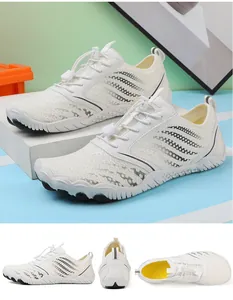 Detail view of cream water shoes showing mesh fabric and quick-dry toggle lacing system