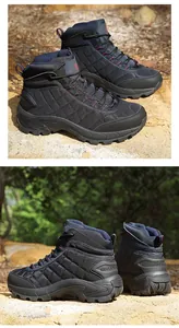 Detailed view of durable hiking boots with non-slip rubber soles on rocky terrain