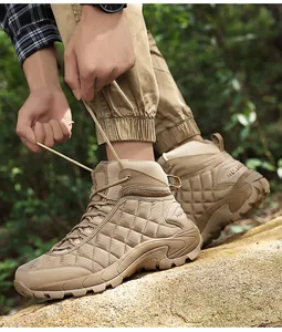 Detail shot of khaki tactical hiking boot showing durable lug sole and diamond quilting