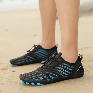 Breathable black and blue water shoes for men and women on a sunny beach environment