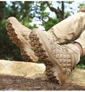 Deep lug anti-slip sole detail of khaki outdoor tactical boots for desert terrain