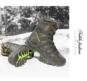 Detail of high-top outdoor boots with faux fur lining and deep tread sole on snow